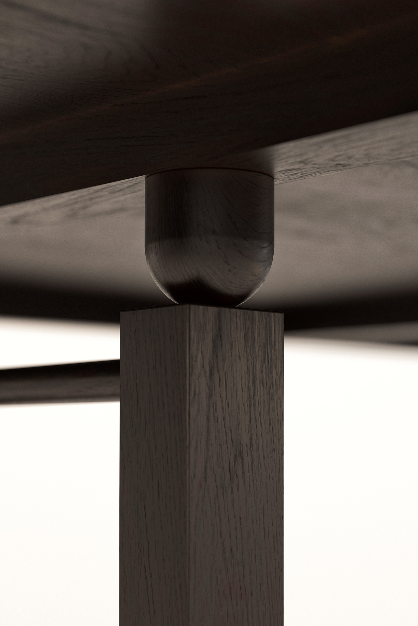 Écrin – détail d'assemblage table en chêne teinté sombre, jonction arrondie entre plateau et pied carré