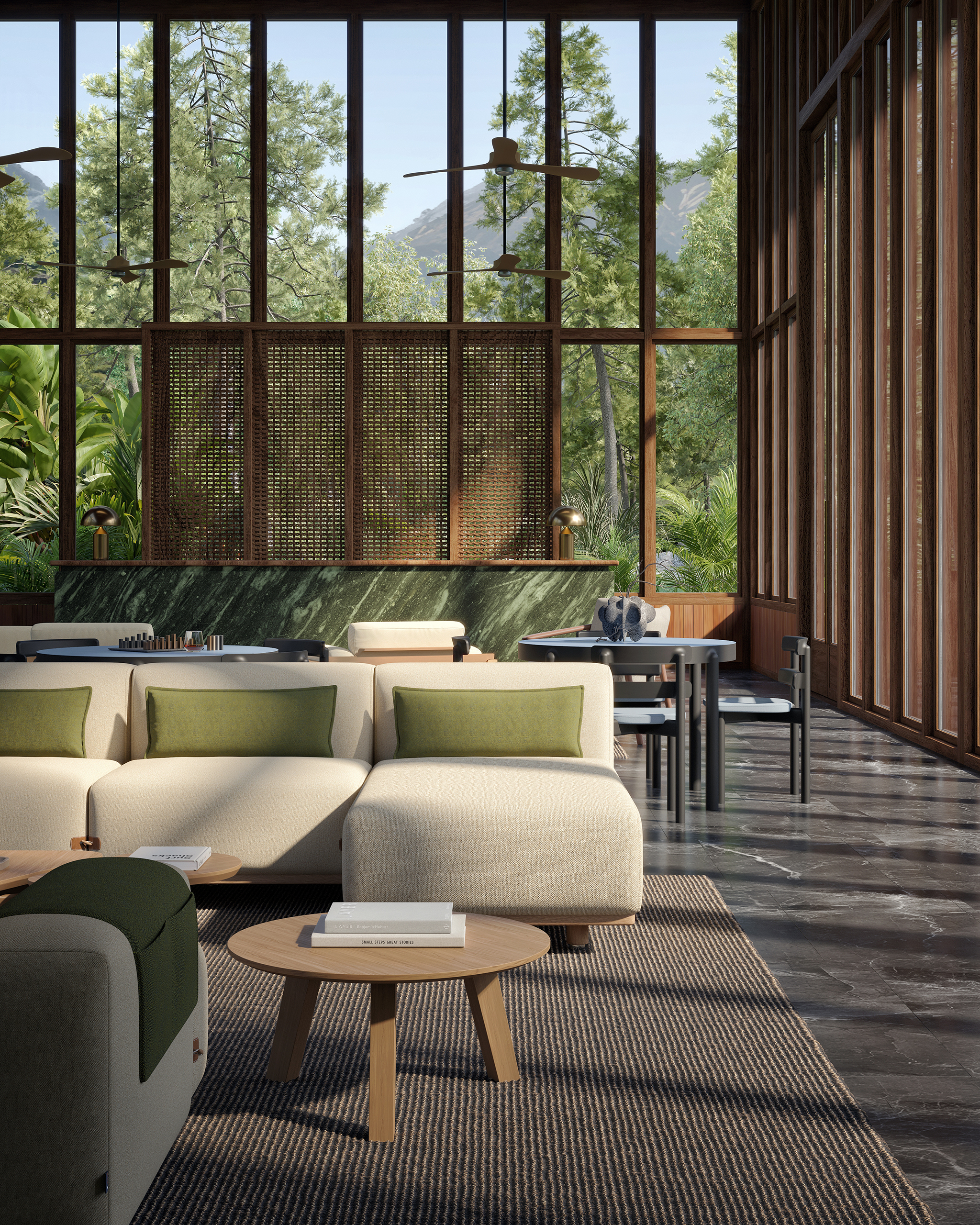 Bosc – salon vitré double hauteur en bois, grande baie sur forêt et montagne, canapé crème coussins verts, tables basses Escamp en chêne