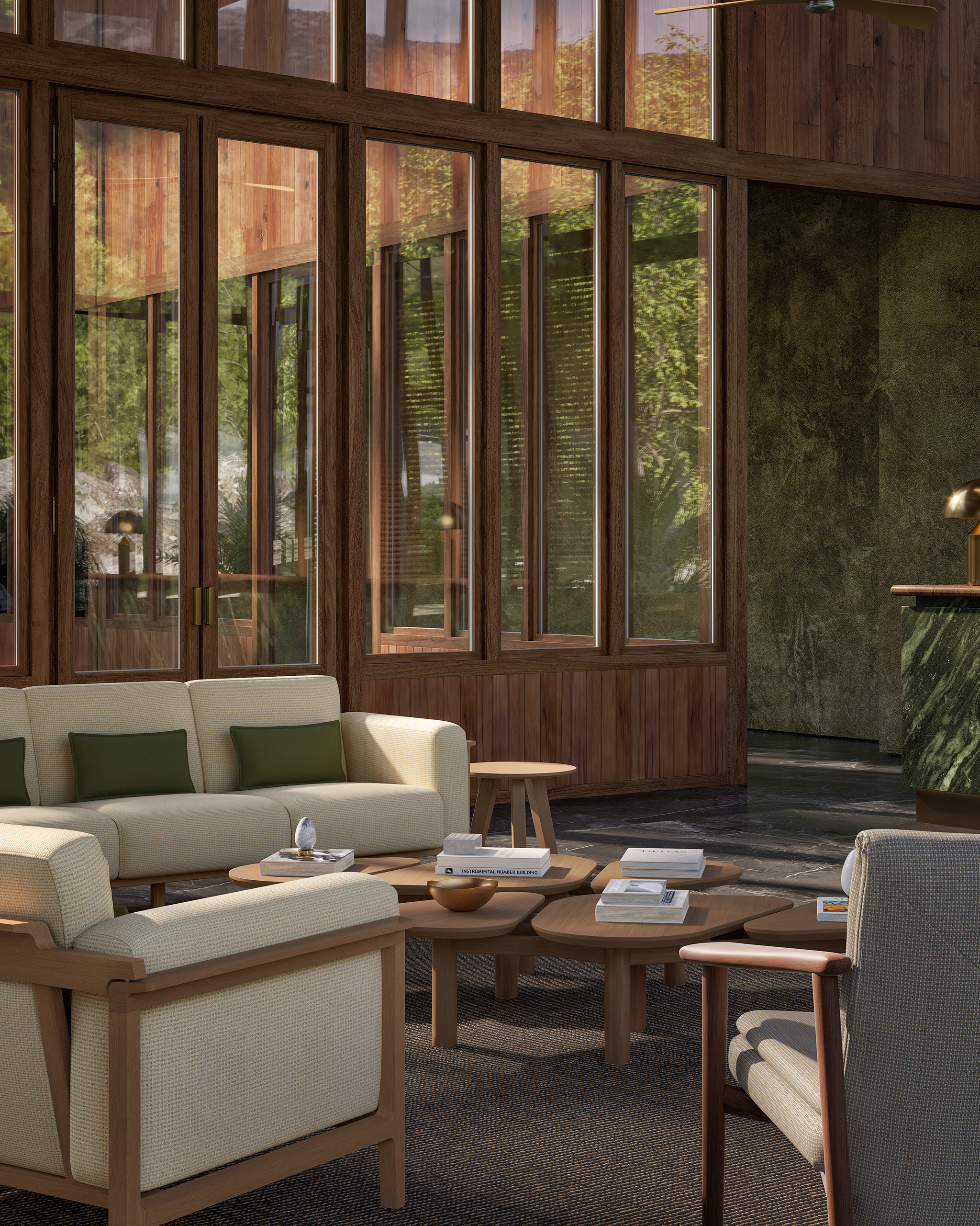 Bosc – salon vitré double hauteur en bois, grande baie sur forêt et montagne, canapé crème coussins verts, tables basses Escamp en chêne