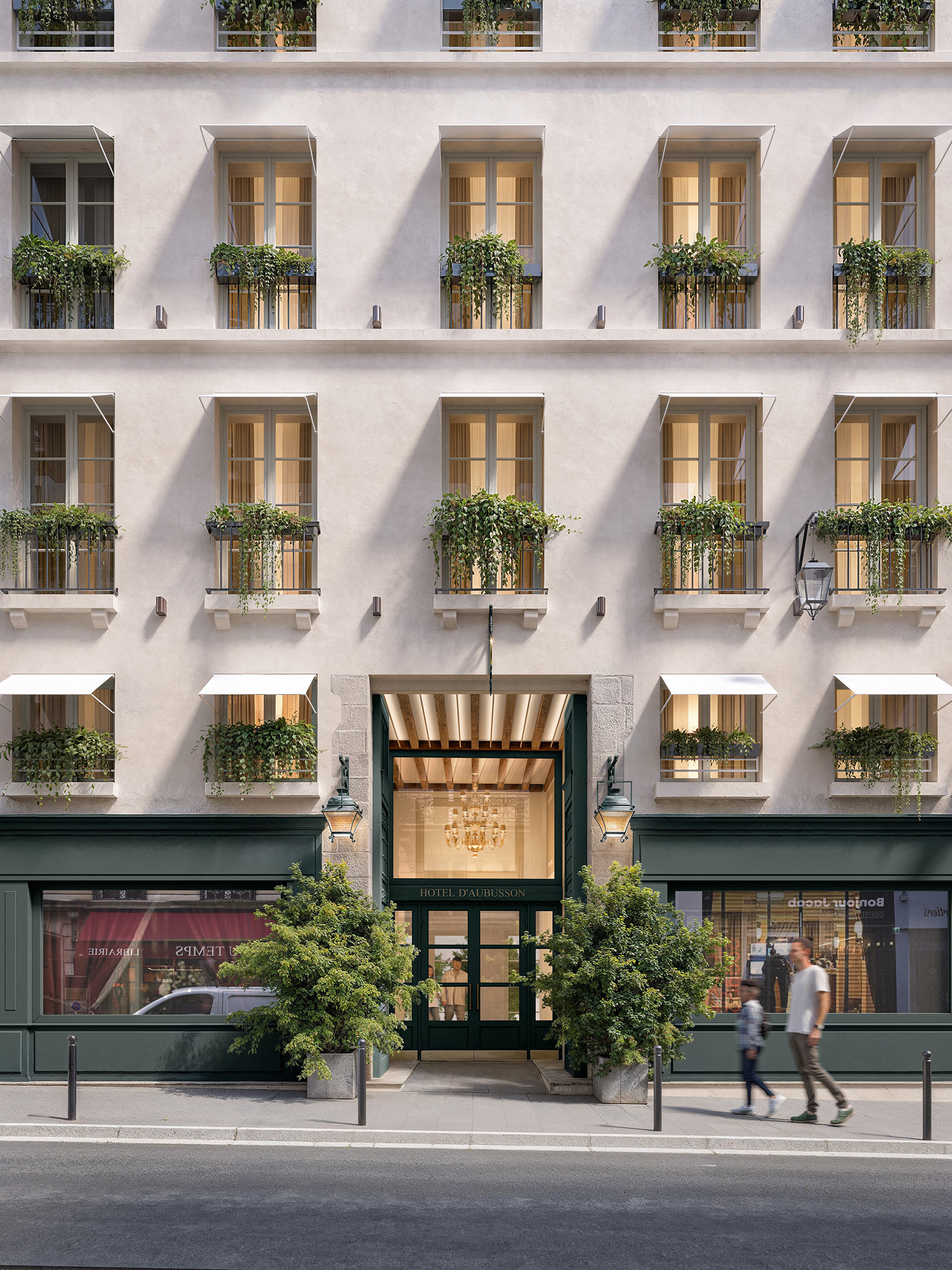 Façade rénovée de l'Hôtel d'Aubusson Paris 6e – enduit clair, menuiseries vert anglais, jardinières fleuries et entrée lumineuse avec lustre