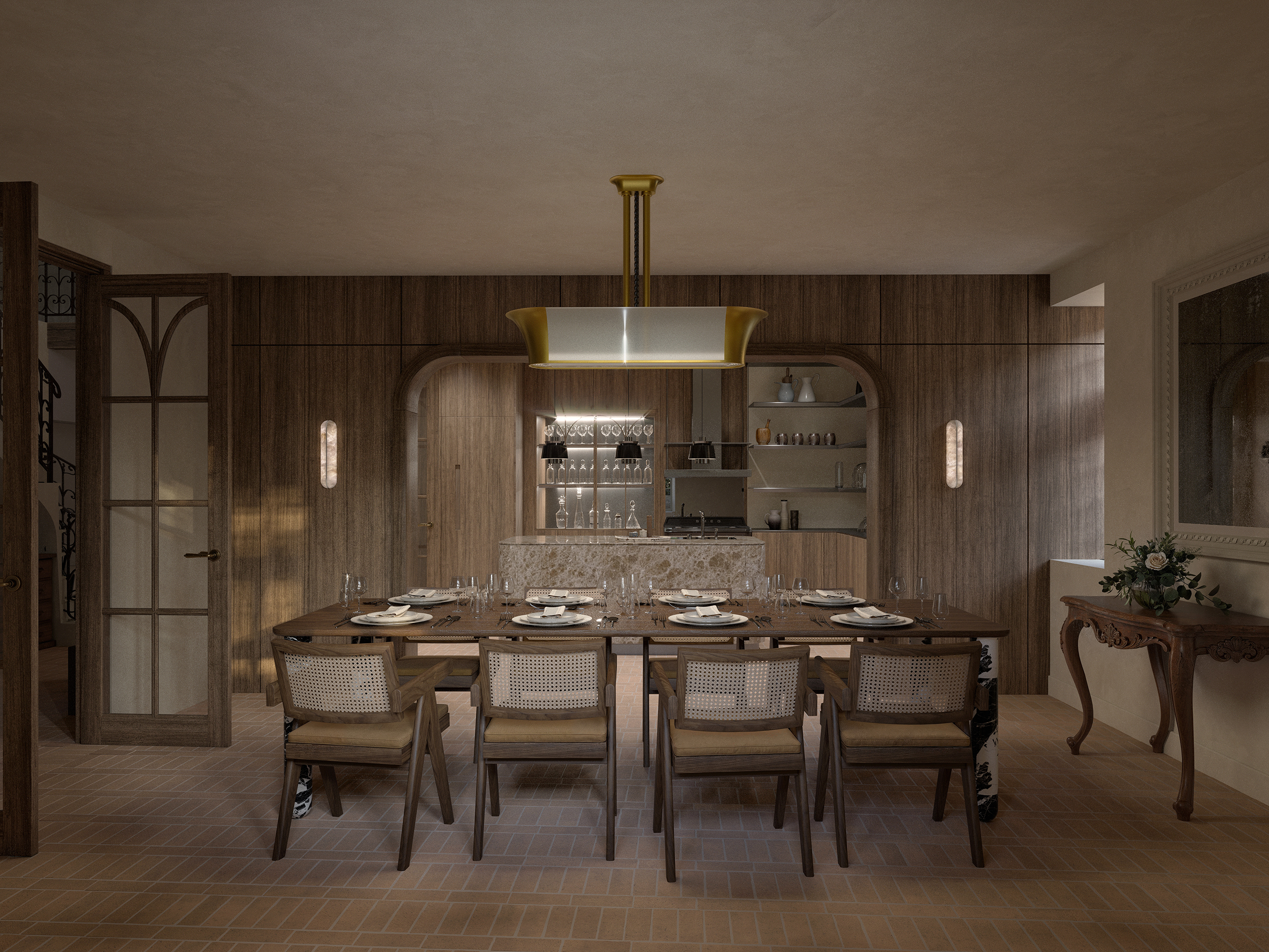 Salle à manger du château La Baume en Ardèche – boiseries en noyer, table dressée pour huit, suspension laiton et cuisine ouverte en arche