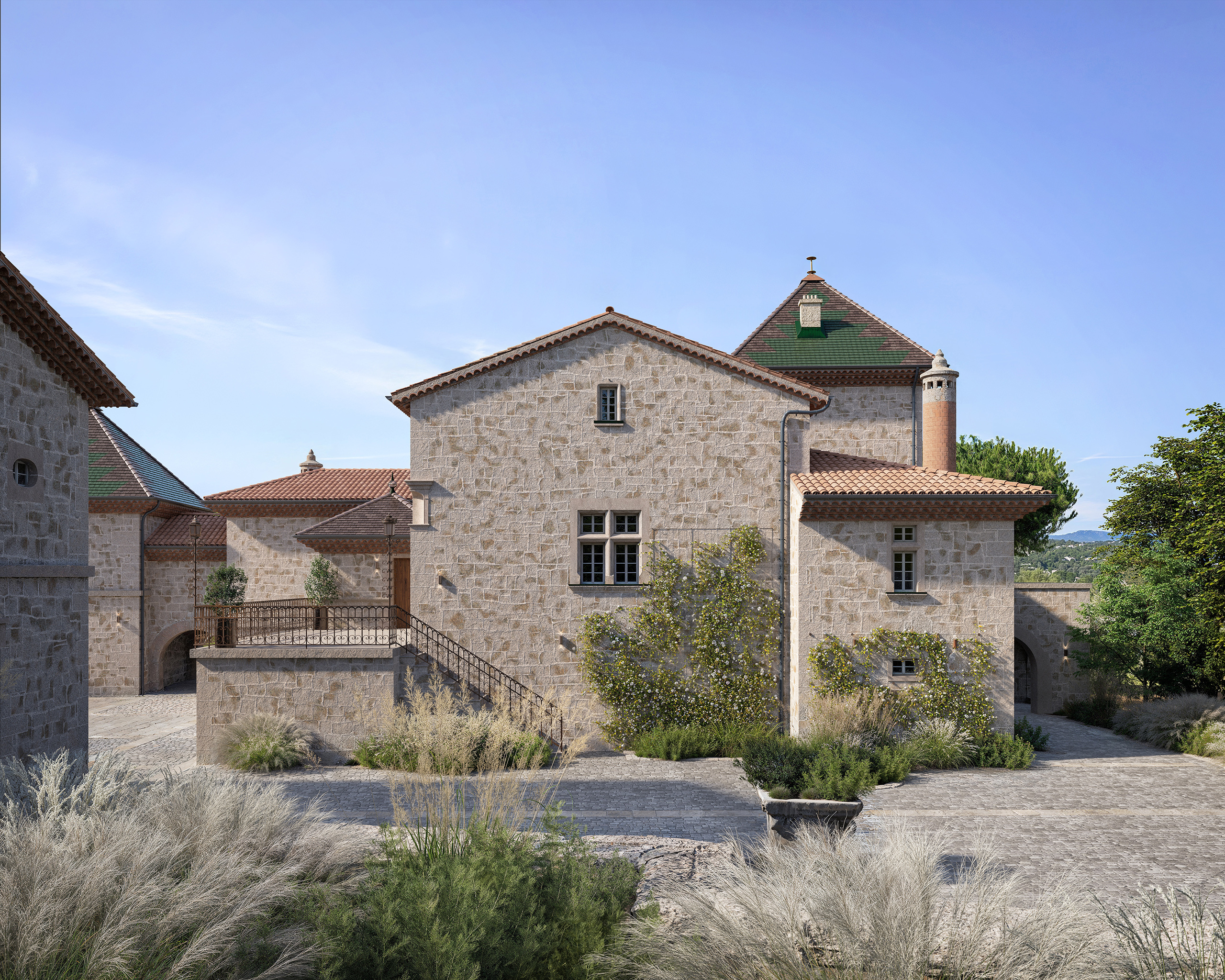 Château de La Baume en Ardèche – façade en pierre de taille, tourelle en brique, toiture en tuiles canal et cour pavée paysagère