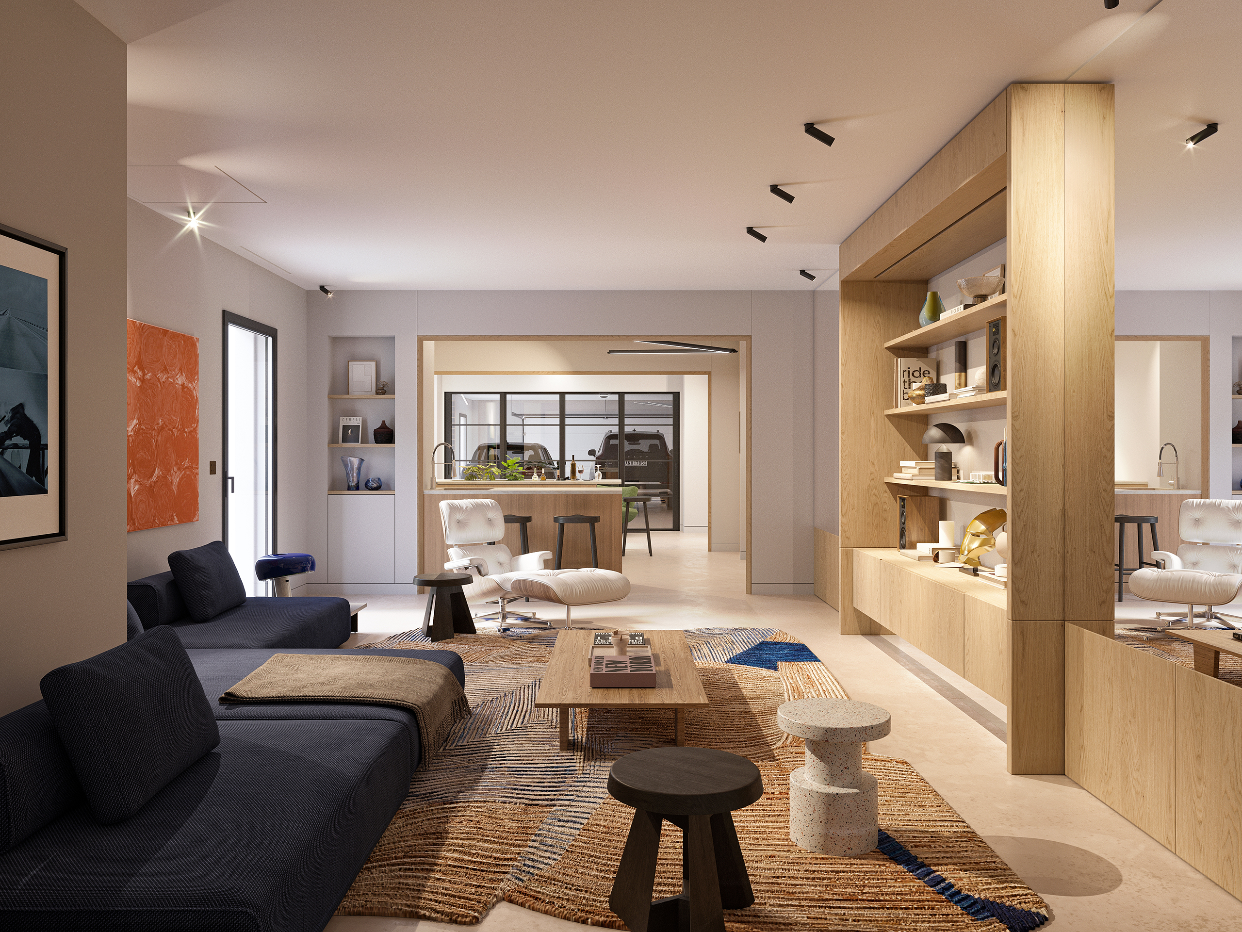 Salon contemporain du projet Reynard, bibliothèque en chêne, canapé bleu nuit, fauteuil Eames et vue sur garage vitré.