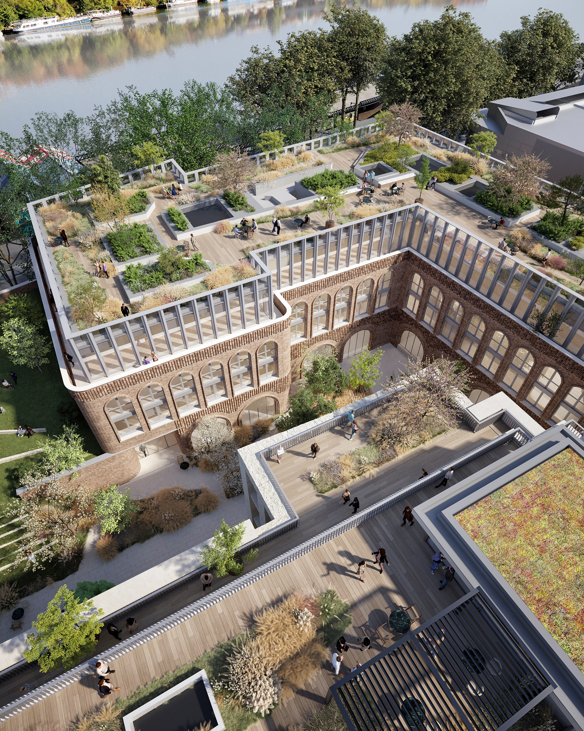 Vue aérienne du projet Saint-Cloud Campus – réhabilitation d'un bâtiment en brique à arches, toiture-jardin végétalisée et terrasses animées en bord de Seine