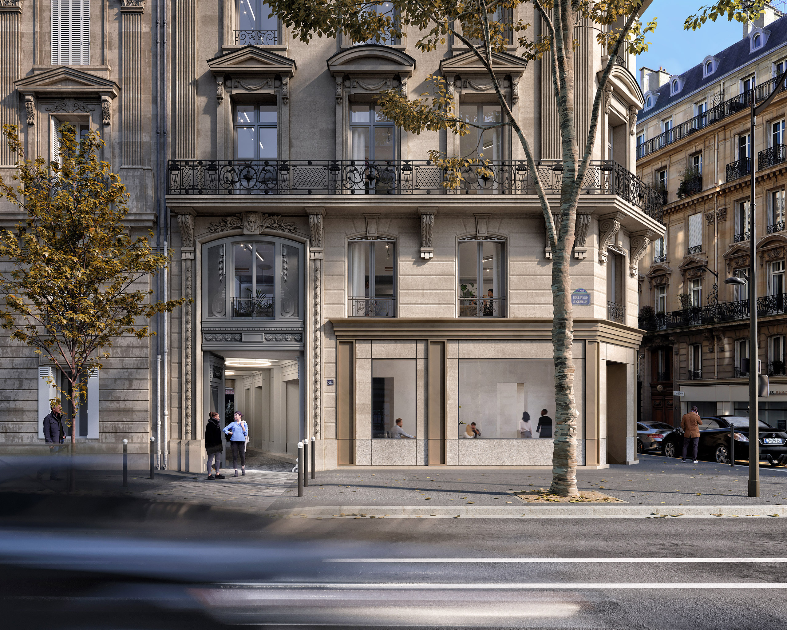 Façade du projet Saint-Germain – rez-de-chaussée commercial en pierre de taille et métal doré, immeuble haussmannien réhabilité boulevard Saint-Germain