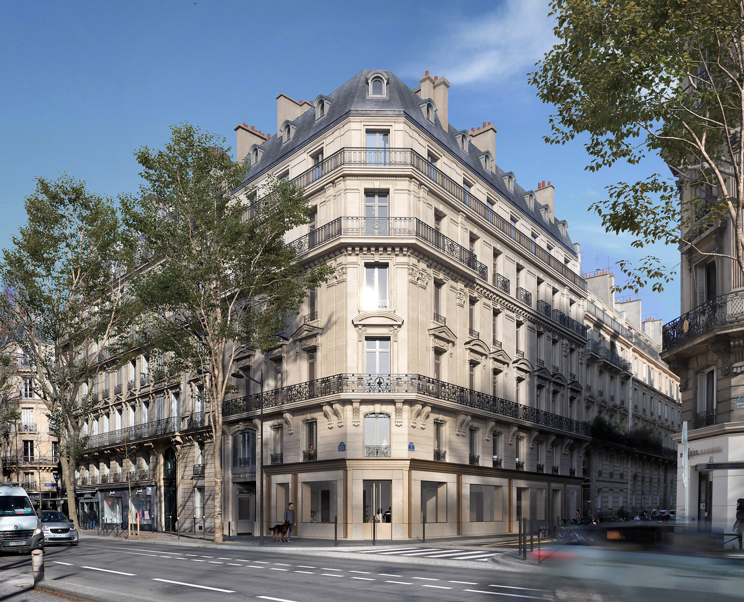 Vue d'angle du projet Saint-Germain – immeuble haussmannien restauré en coin, rez-de-chaussée commercial en pierre et métal doré, boulevard Saint-Germain Paris