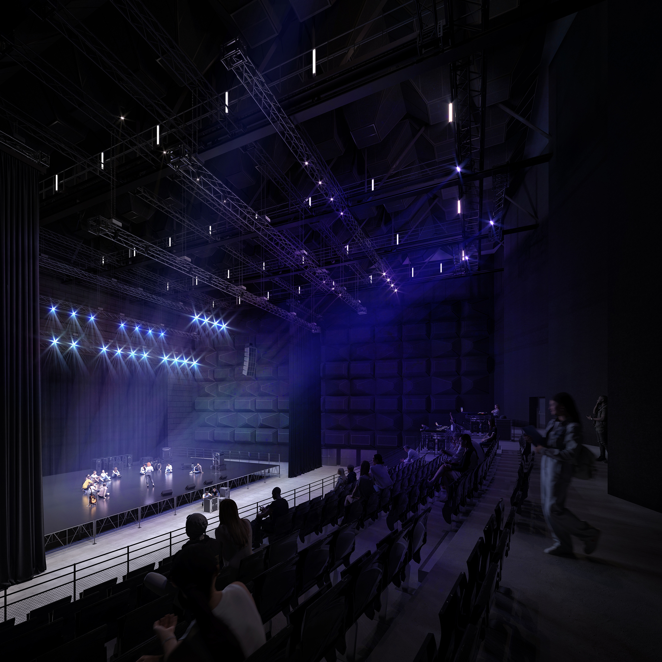 Plateau de studio de tournage Studio BIG à Rungis – salle de spectacle modulable, gril technique, éclairage scénique bleu et gradins