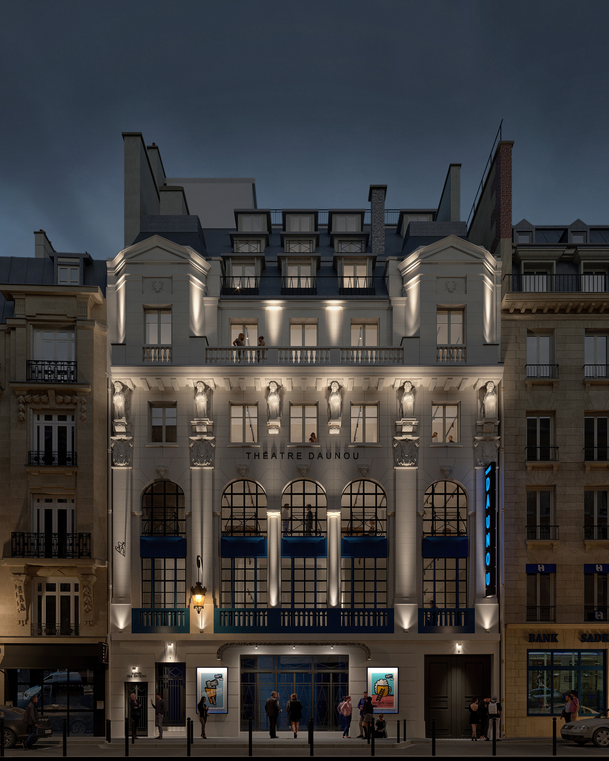 Façade du Théâtre Daunou illuminée de nuit – pierre sculptée, caryatides, menuiseries bleu nuit et éclairage architectural.